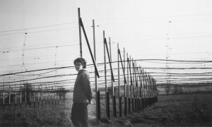 J. Bell by the radio antenna she worked on.