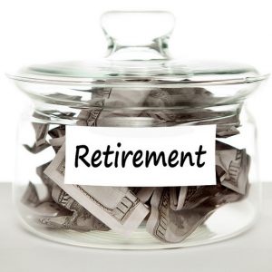 A glass jar labelled "Retirement" is filled with cash.