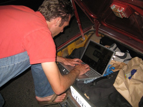 A man typing on his laptop.
