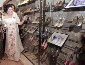 Imelda Marcos' shoes in a glass display case.
