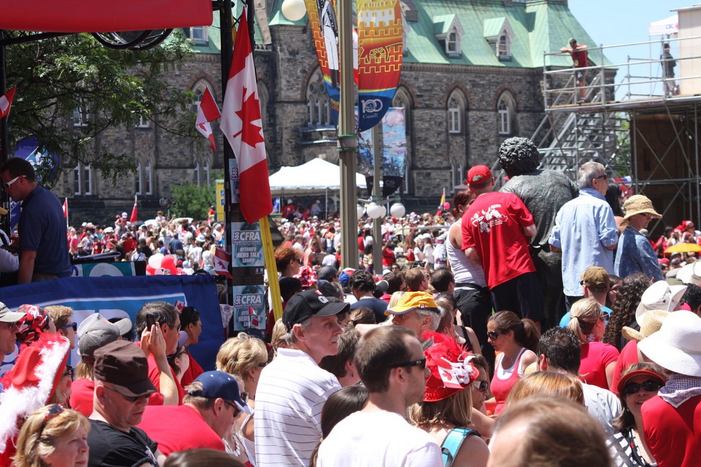 A crowd of people celebrating Canada day
