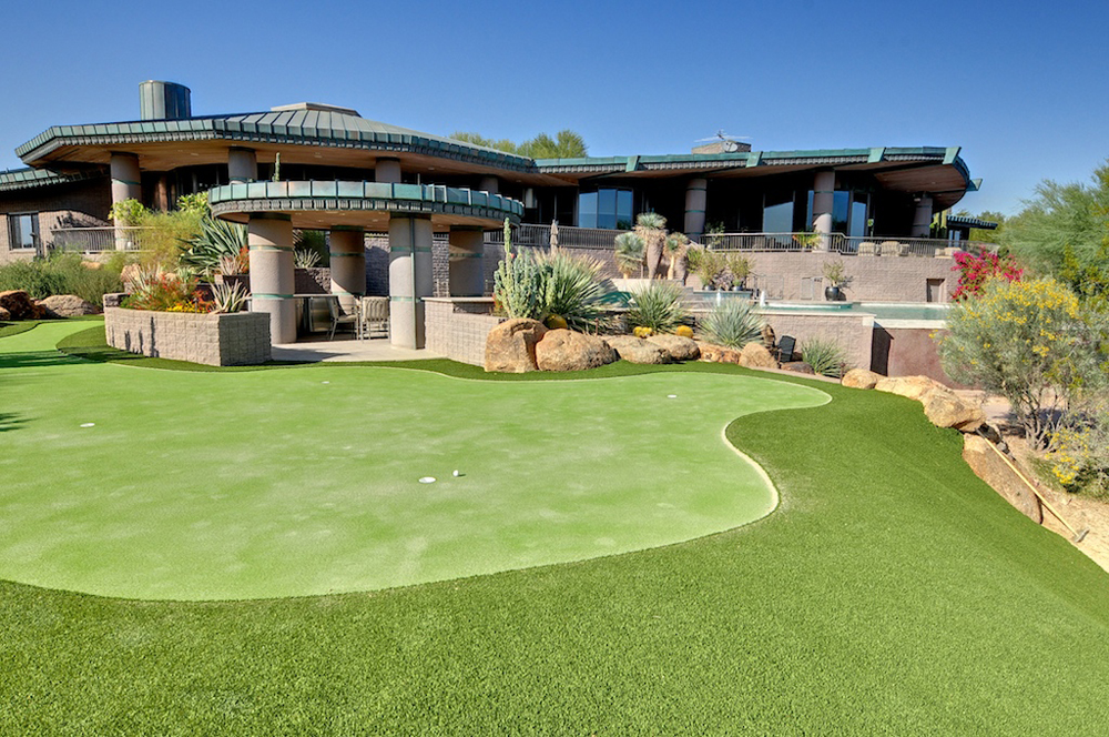 A luxurious house with a golf course.