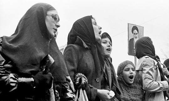Women in hijabs protesting.