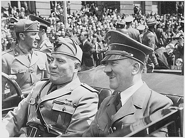 Adolf Hitler and Benito Mussolini riding in a car together.
